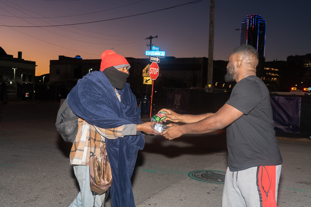 Volunteers handing out food packages in Dallas neighborhoods